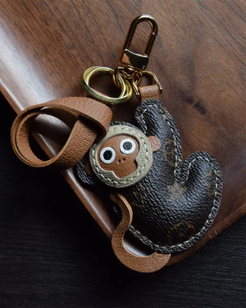 Monkey bag charm handcrafted from premium leather, fully hand-stitched over three days and gift boxed for bags, keys, or car accessories.