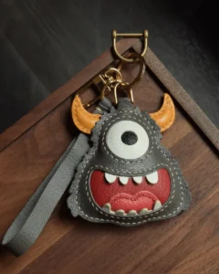 leather monster bag charm, handmade leather keychain, cartoon monster accessory, gift box, playful bag charm