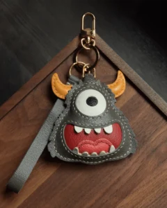 leather monster bag charm, handmade leather keychain, cartoon monster accessory, gift box, playful bag charm