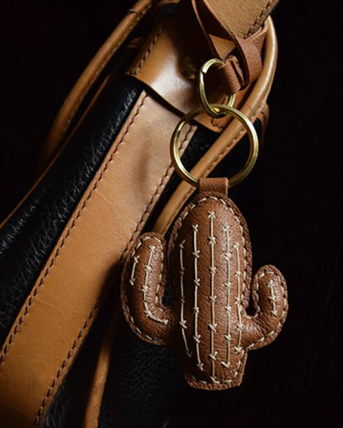 Cactus bag charm handcrafted from French goatskin leather, hand-stitched over three days and gift boxed for bags, keys, or car key accessories.