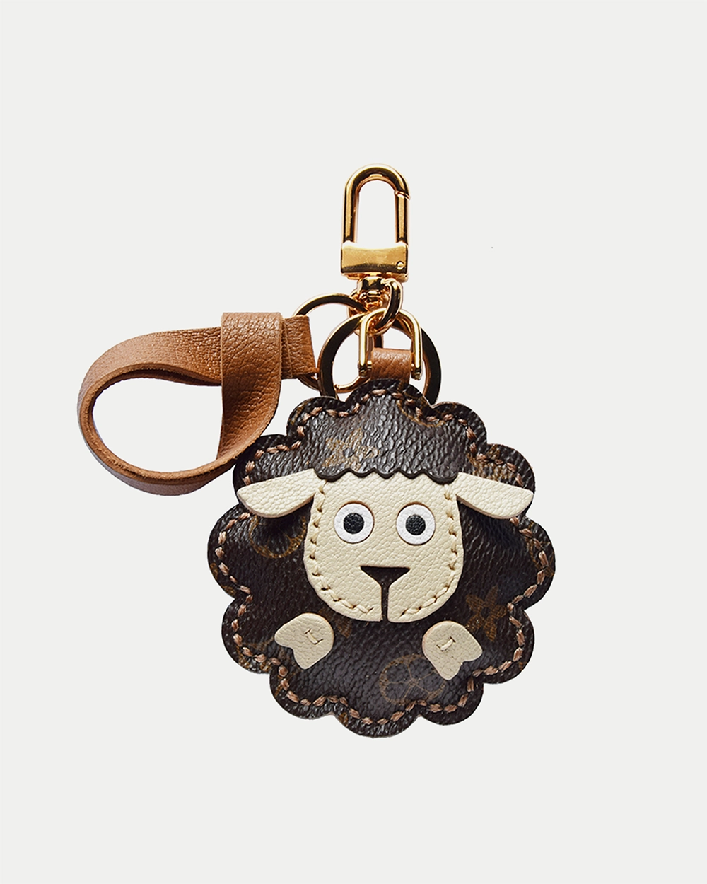 A cute sheep bag charm handcrafted from French goatskin leather. Hand-stitched over three days and gift boxed, perfect for bags, keys, or car keys.