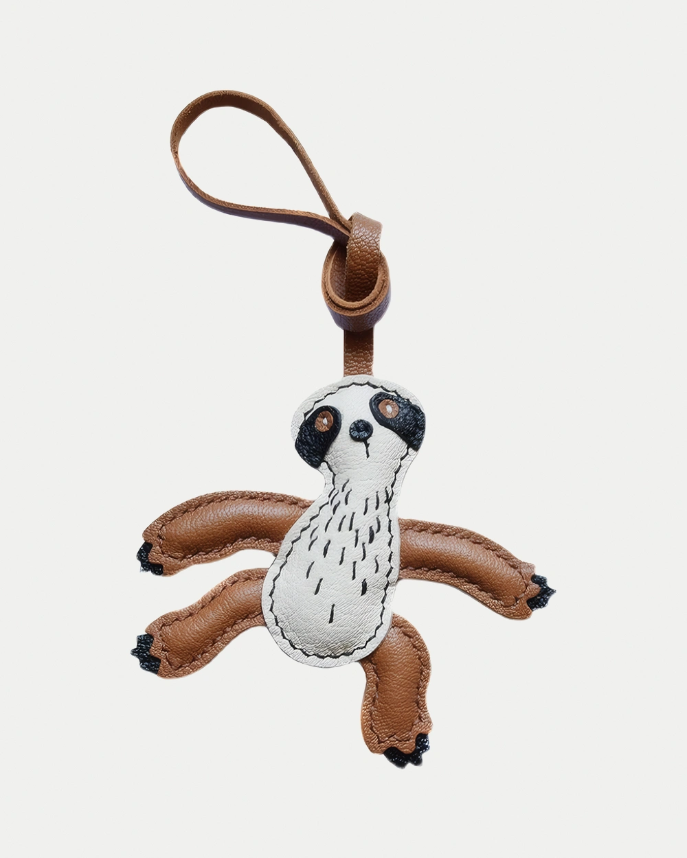 Sloth Bag Charm handcrafted from French goatskin leather, hand-stitched over three days and gift boxed for bags, keys, and car key accessories.