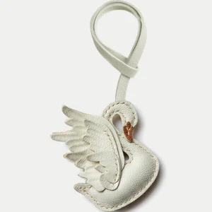 An elegant swan bag charm handcrafted from French goatskin leather. Hand-stitched over three days and gift boxed, ideal for bags, keys, or car keys.