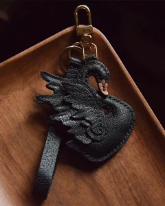 An elegant swan bag charm handcrafted from French goatskin leather. Hand-stitched over three days and gift boxed, ideal for bags, keys, or car keys.