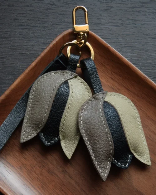Tulip Bag Charm handcrafted from French goatskin leather, hand-stitched over three days and gift boxed for bags, keys, and car key accessories.