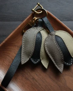 Tulip Bag Charm handcrafted from French goatskin leather, hand-stitched over three days and gift boxed for bags, keys, and car key accessories.