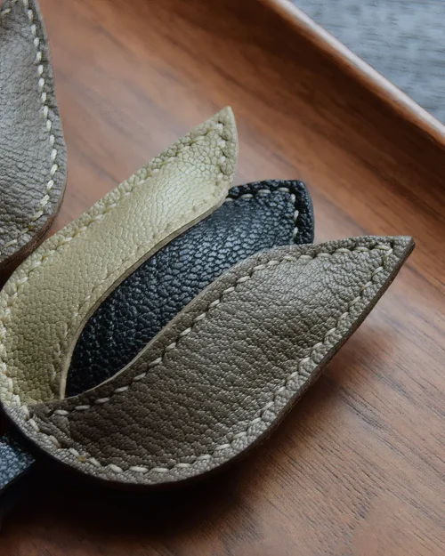 Tulip Bag Charm handcrafted from French goatskin leather, hand-stitched over three days and gift boxed for bags, keys, and car key accessories.