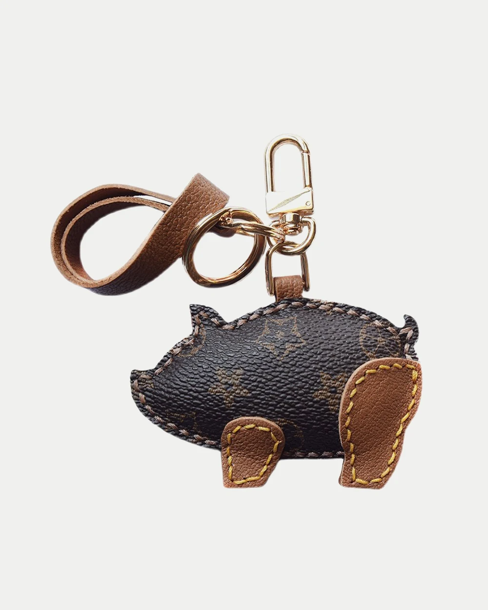 Wild boar bag charm handcrafted from premium leather, hand-stitched over three days and gift boxed for bags, keys, or car key accessories.