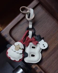 A festive letter bag charm handcrafted from French goatskin leather. Choose from 26 letters and create custom combinations, hand-stitched and gift boxed.