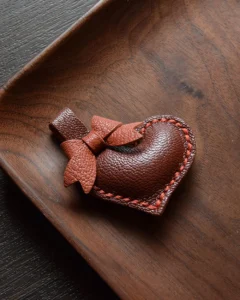 Keychain accessory components set featuring brass hardware, leather tassels, cords, and connectors for bag charms, keychains, and car key accessories.