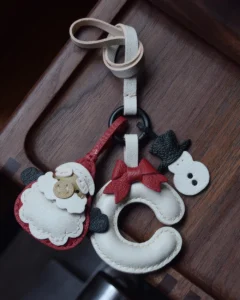 A festive letter bag charm handcrafted from French goatskin leather. Choose from 26 letters and create custom combinations, hand-stitched and gift boxed.