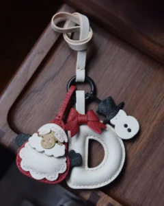 A festive letter bag charm handcrafted from French goatskin leather. Choose from 26 letters and create custom combinations, hand-stitched and gift boxed.