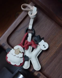 A festive letter bag charm handcrafted from French goatskin leather. Choose from 26 letters and create custom combinations, hand-stitched and gift boxed.