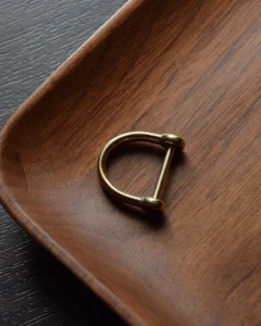 Keychain accessory components set featuring brass hardware, leather tassels, cords, and connectors for bag charms, keychains, and car key accessories.