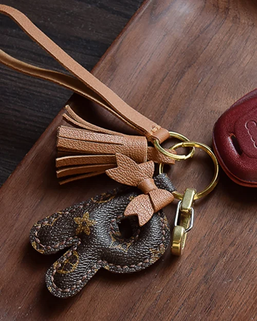 A handcrafted leather letter bag charm with tassel detail. Made by hand over three days, gift-boxed and perfect for bags, keys, or car keys. Choose your letter at checkout.