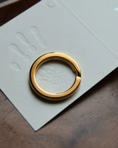 Keychain accessory components set featuring brass hardware, leather tassels, cords, and connectors for bag charms, keychains, and car key accessories.