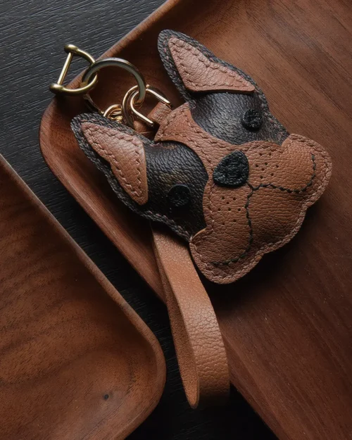 Dog Bag Charm handcrafted from French goatskin leather, hand-stitched over three days and gift boxed for bags, keys, and car key accessories.