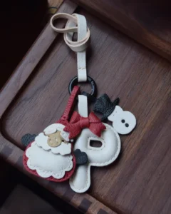 A festive letter bag charm handcrafted from French goatskin leather. Choose from 26 letters and create custom combinations, hand-stitched and gift boxed.