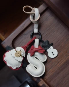 A festive letter bag charm handcrafted from French goatskin leather. Choose from 26 letters and create custom combinations, hand-stitched and gift boxed.