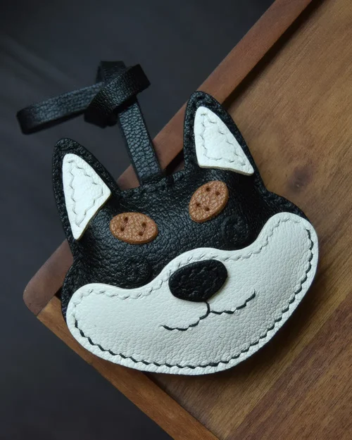 Dog Bag Charm handcrafted from French goatskin leather, hand-stitched over three days and gift boxed for bags, keys, and car key accessories.