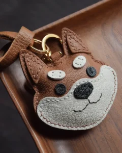 Dog Bag Charm handcrafted from French goatskin leather, hand-stitched over three days and gift boxed for bags, keys, and car key accessories.