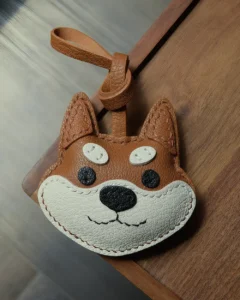 Dog Bag Charm handcrafted from French goatskin leather, hand-stitched over three days and gift boxed for bags, keys, and car key accessories.