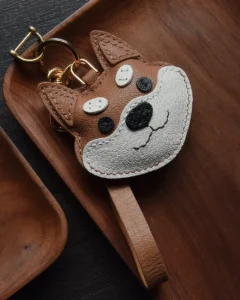 Dog Bag Charm handcrafted from French goatskin leather, hand-stitched over three days and gift boxed for bags, keys, and car key accessories.
