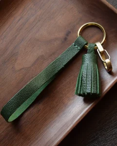 Leather Tassel Bag Charm handcrafted from premium leather. Hand-stitched over three days and gift boxed for bags, keys, or car keys.