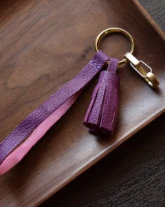Leather Tassel Bag Charm handcrafted from premium leather. Hand-stitched over three days and gift boxed for bags, keys, or car keys.
