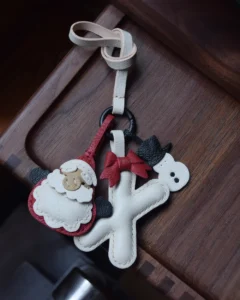 A festive letter bag charm handcrafted from French goatskin leather. Choose from 26 letters and create custom combinations, hand-stitched and gift boxed.