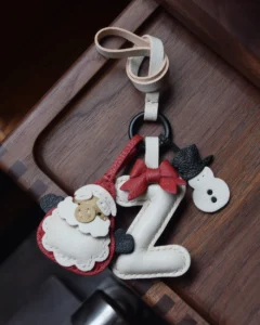 A festive letter bag charm handcrafted from French goatskin leather. Choose from 26 letters and create custom combinations, hand-stitched and gift boxed.